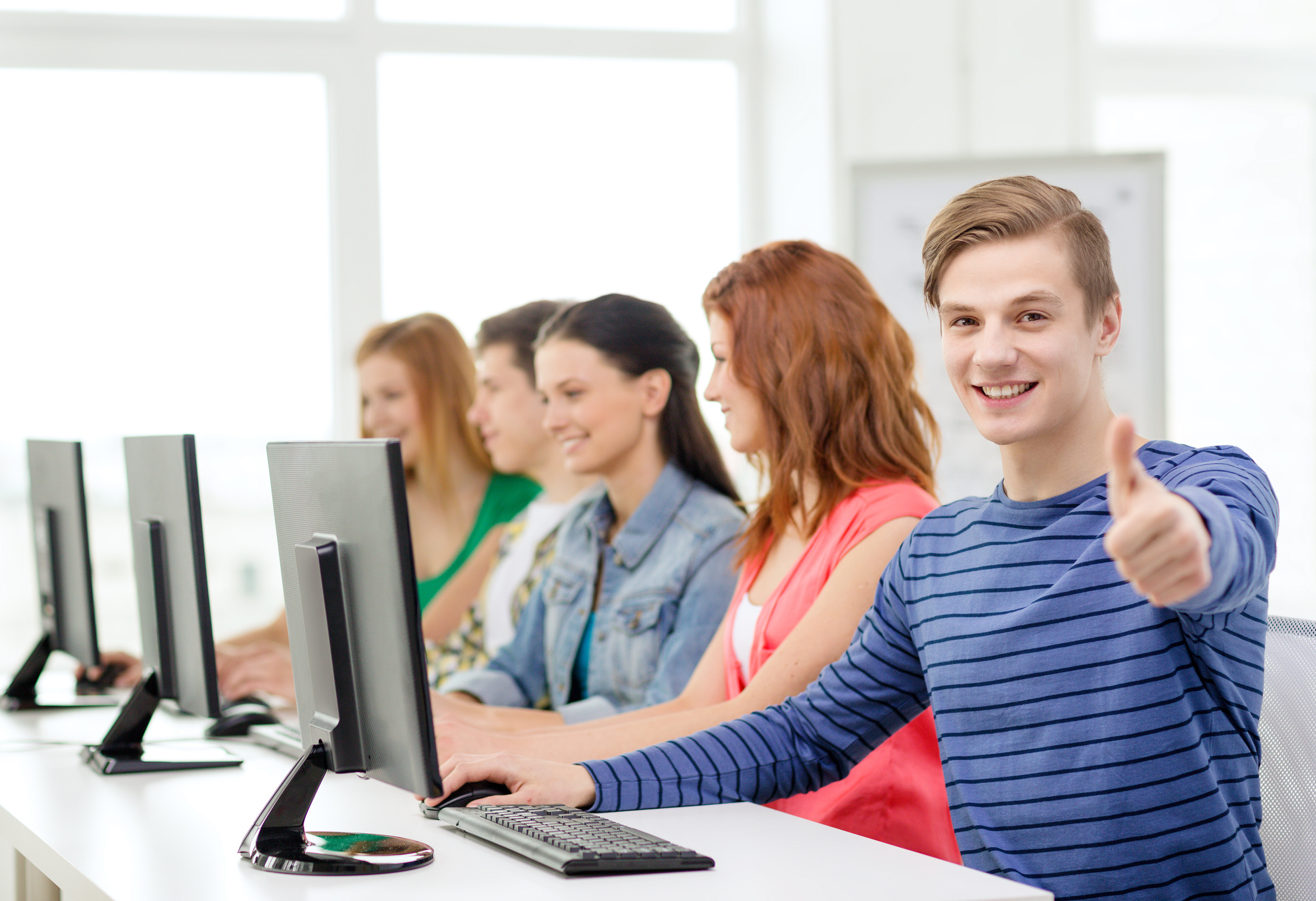 Male Student with Classmates in Computer Class